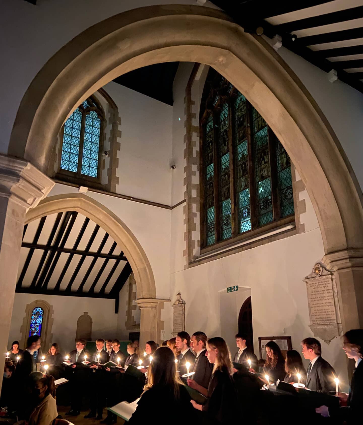 a choir singing by candlelight